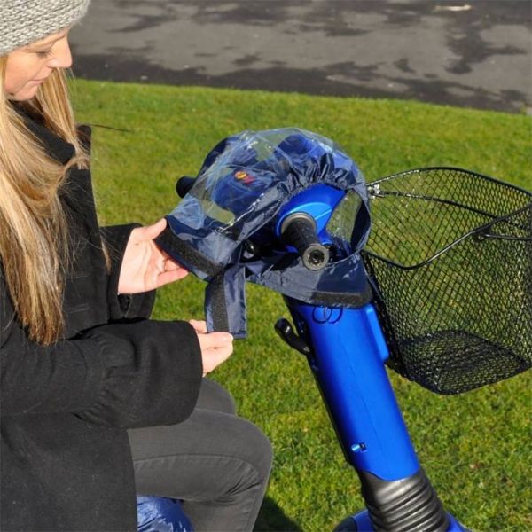 Person attaching a transparent blue cover to the control panel of a mobility scooter.