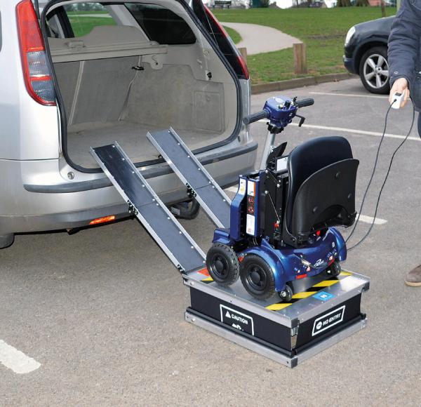 i3 Power Lifter loading a mobility scooter into a car boot with scissor lift action, compact and lightweight design.